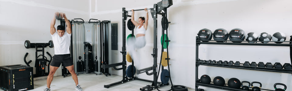 People Working Out at Home With Gym Equipment