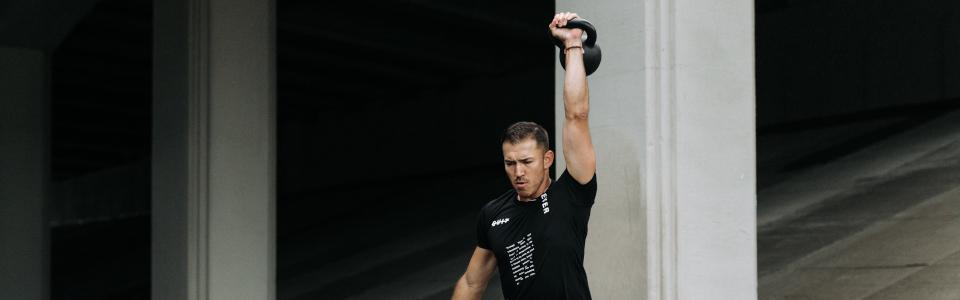 Man Lifting Kettlebell