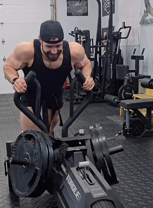 Man exercising with a TANK M3 push sled