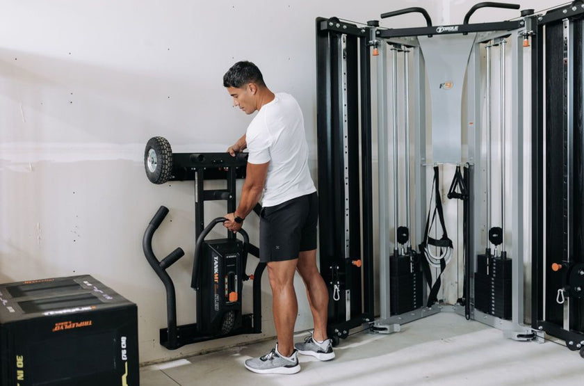 Man Taking TANK M1 Off Of Wall Hanger &lt;black&gt;