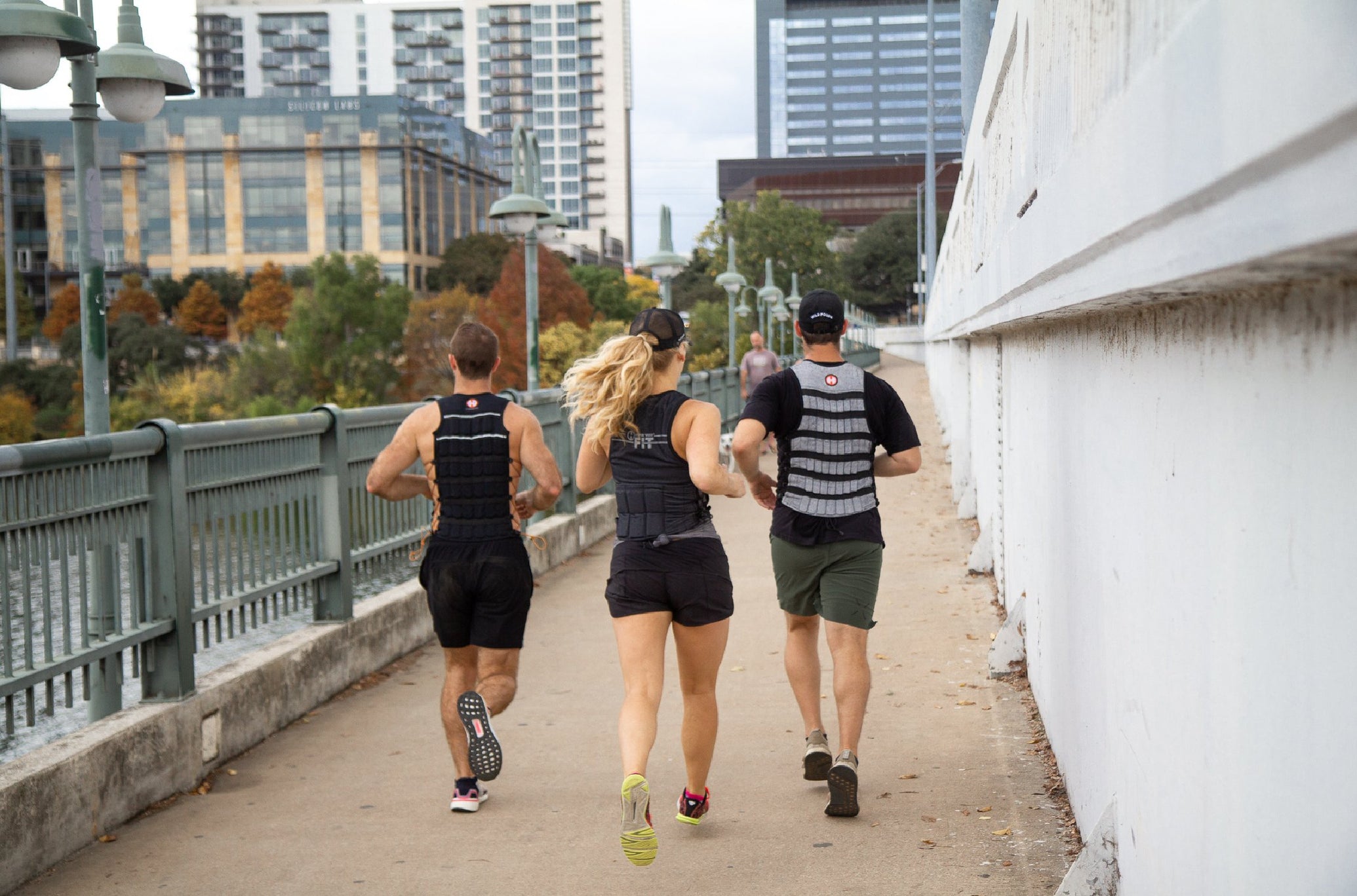People Running Outside Wearing Hyperwear Vests